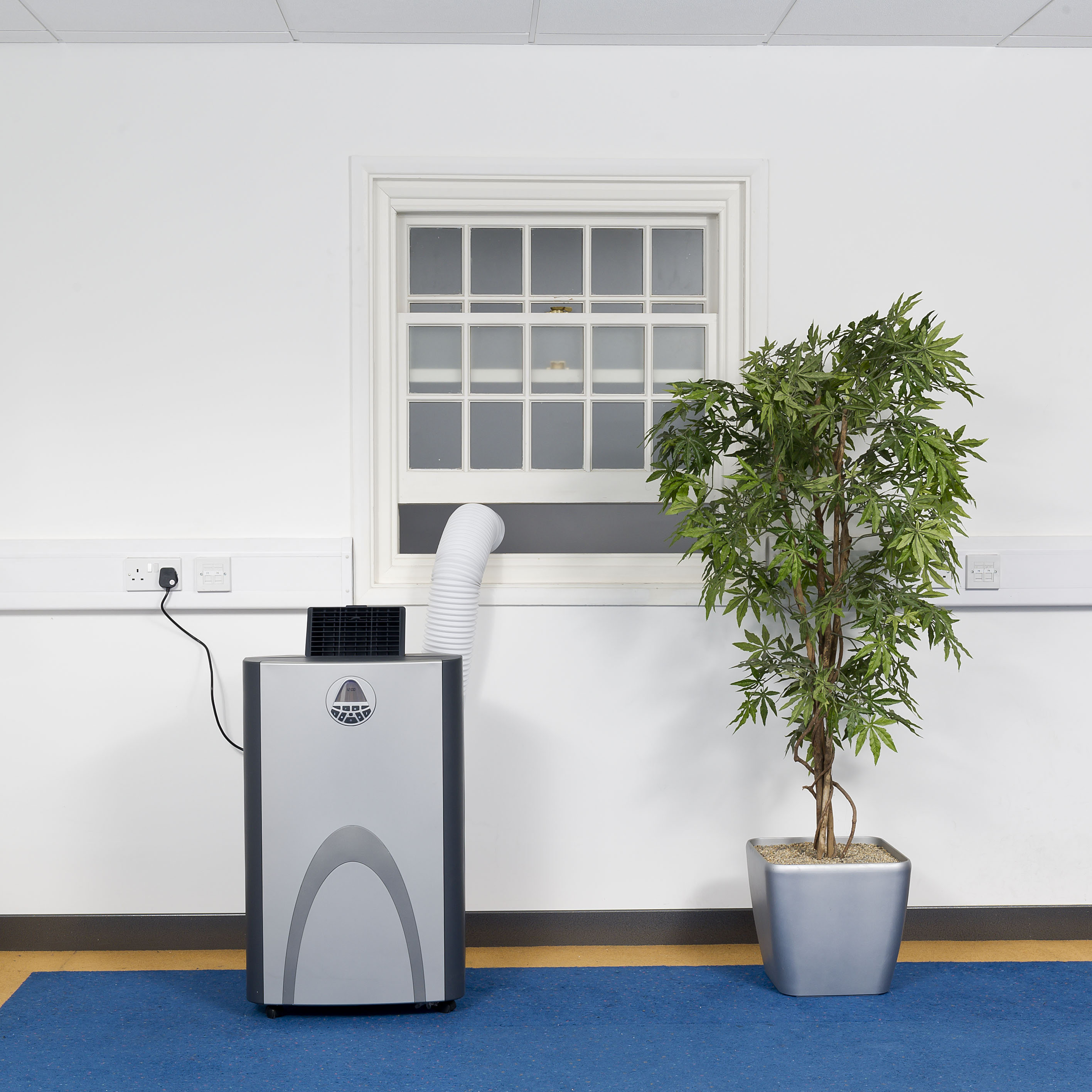 Amcor 3.5kW in an office with hose out the window