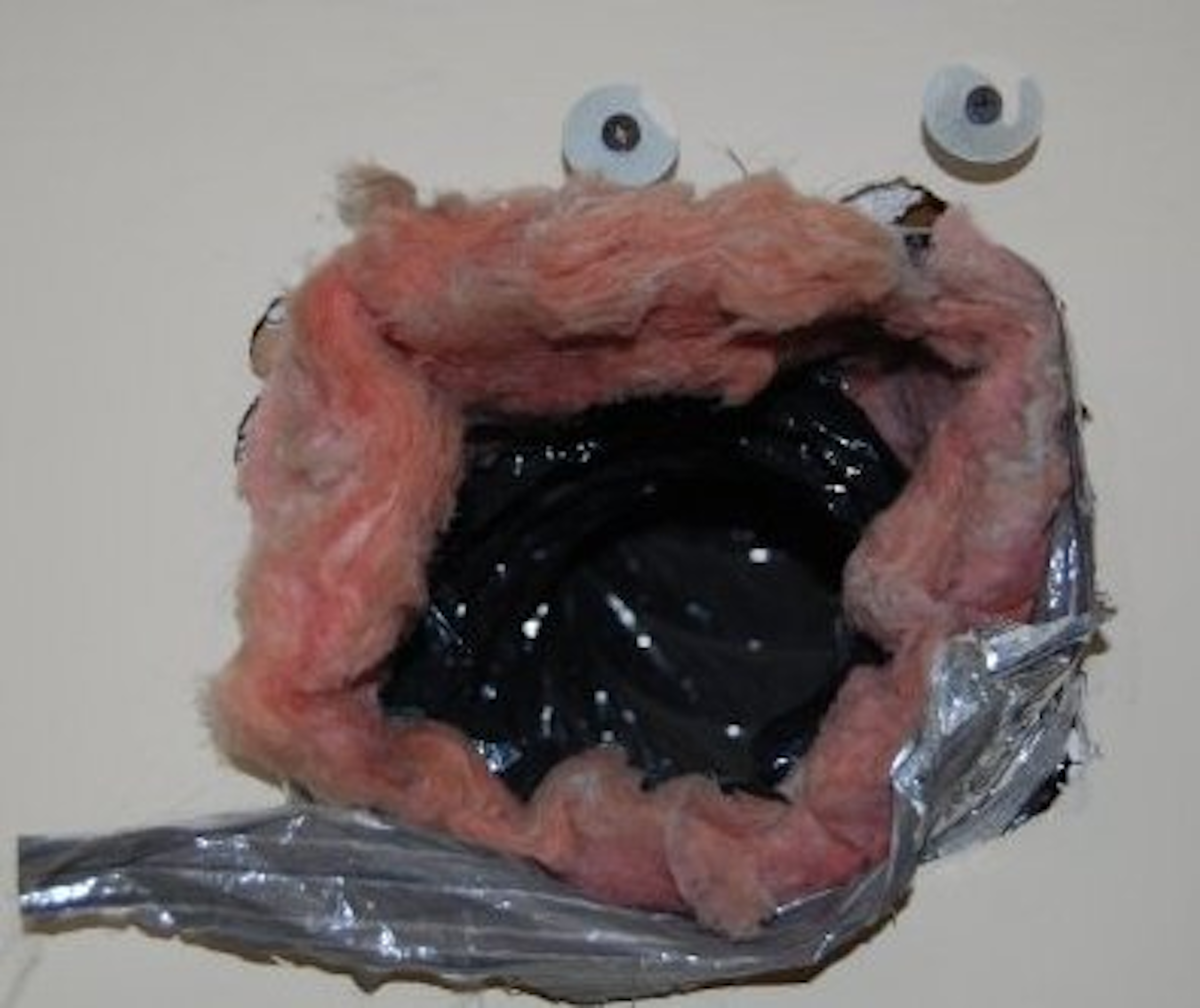 air vent with duct tape and googly eyes
